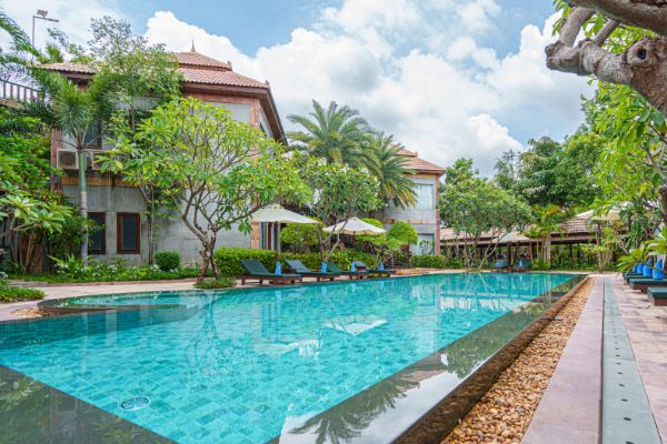 Outdoor swimming pool in the gardens at Karma Bayon