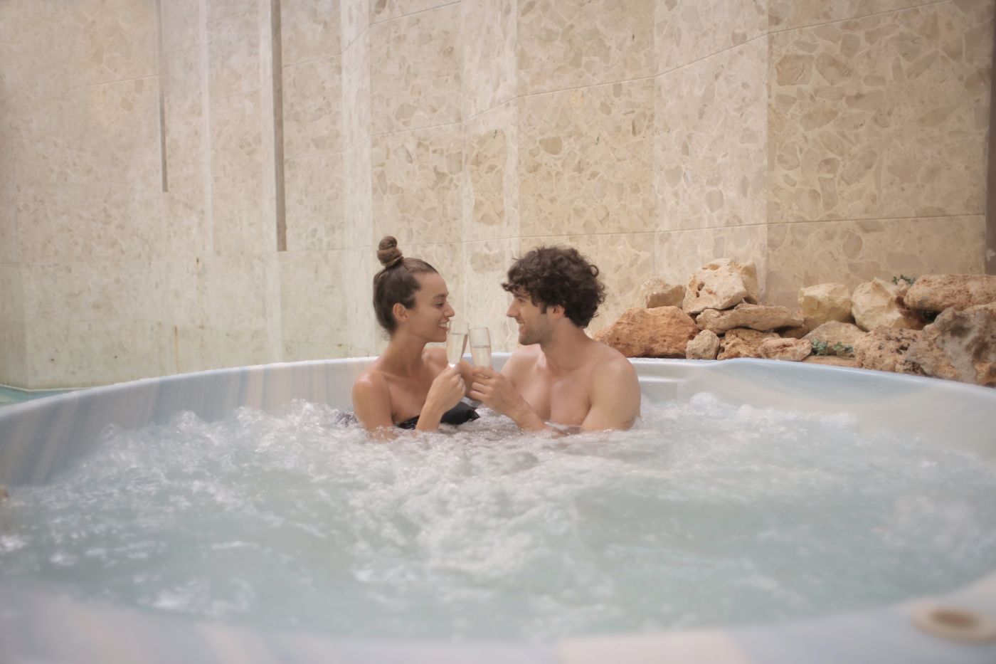 Couple toasting champagne at a luxury resort