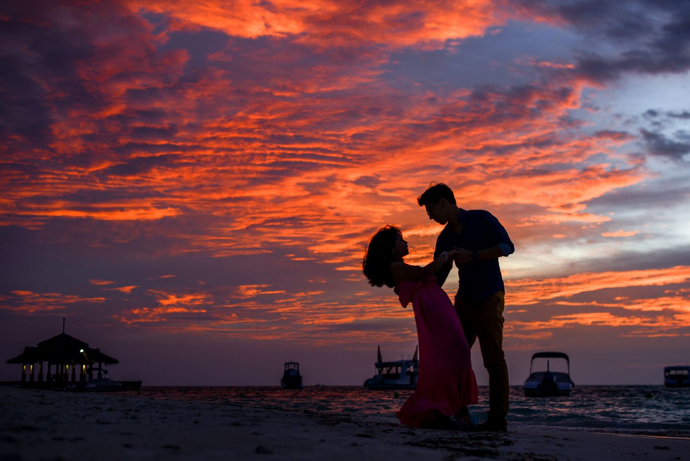 Couple embracing on a Tenerife beach at sunset