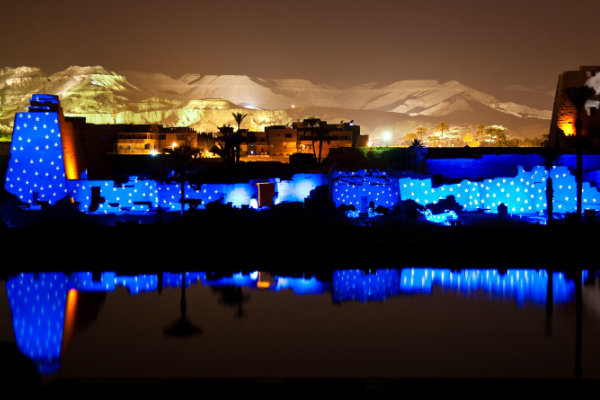Floodlit temple columns in Luxor at night